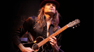 Man playing guitar.